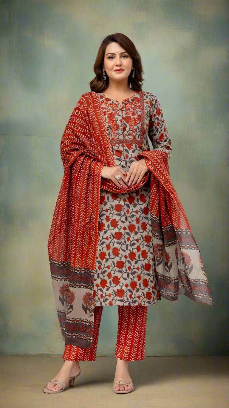 Woman wearing a traditional outfit with a floral pattern on a white background