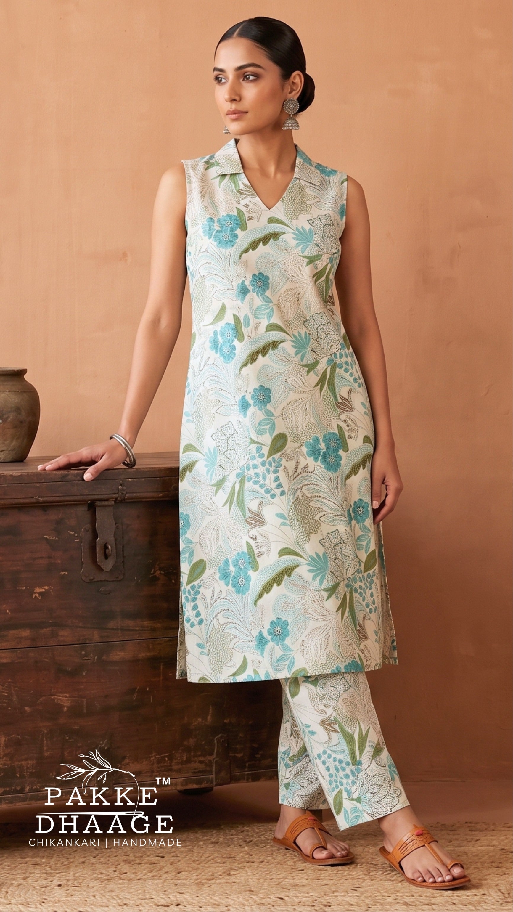 Woman wearing Pakke Dhaage floral printed slub cotton sleeveless co-ord set with notched collar top and trousers.
