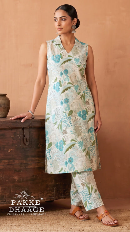 Woman wearing Pakke Dhaage floral printed slub cotton sleeveless co-ord set with notched collar top and trousers.