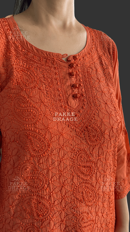 close up of an intricastely embroidered chikankari top