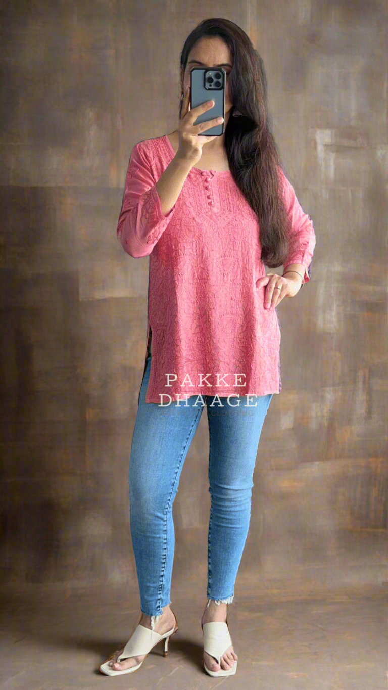 person wearing a pink chikankari top, paired with a light blue jeans