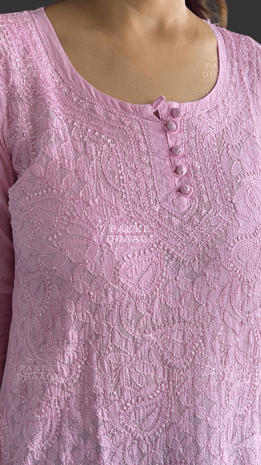 Close-up of a pink chikankari embroidered top with buttons