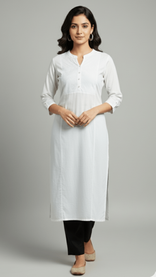 Woman wearing a white kurta with black pants on a gray background