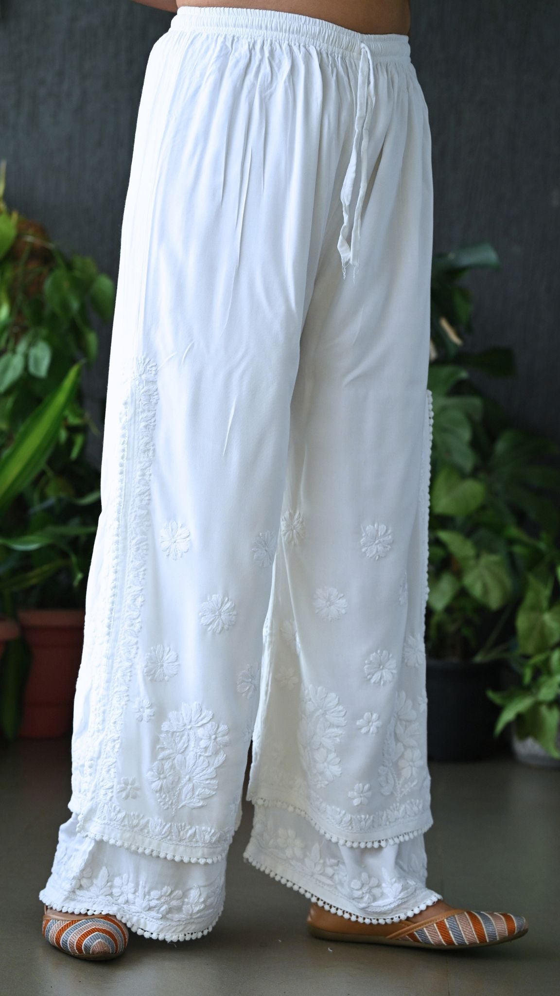 White chikankari embroidered wide-leg pants with a drawstring waist. | Pakke Dhaage