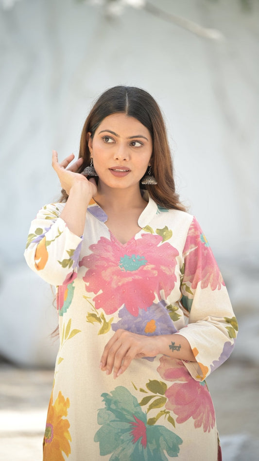 Woman wearing a floral, collared kurti set with a blurred background