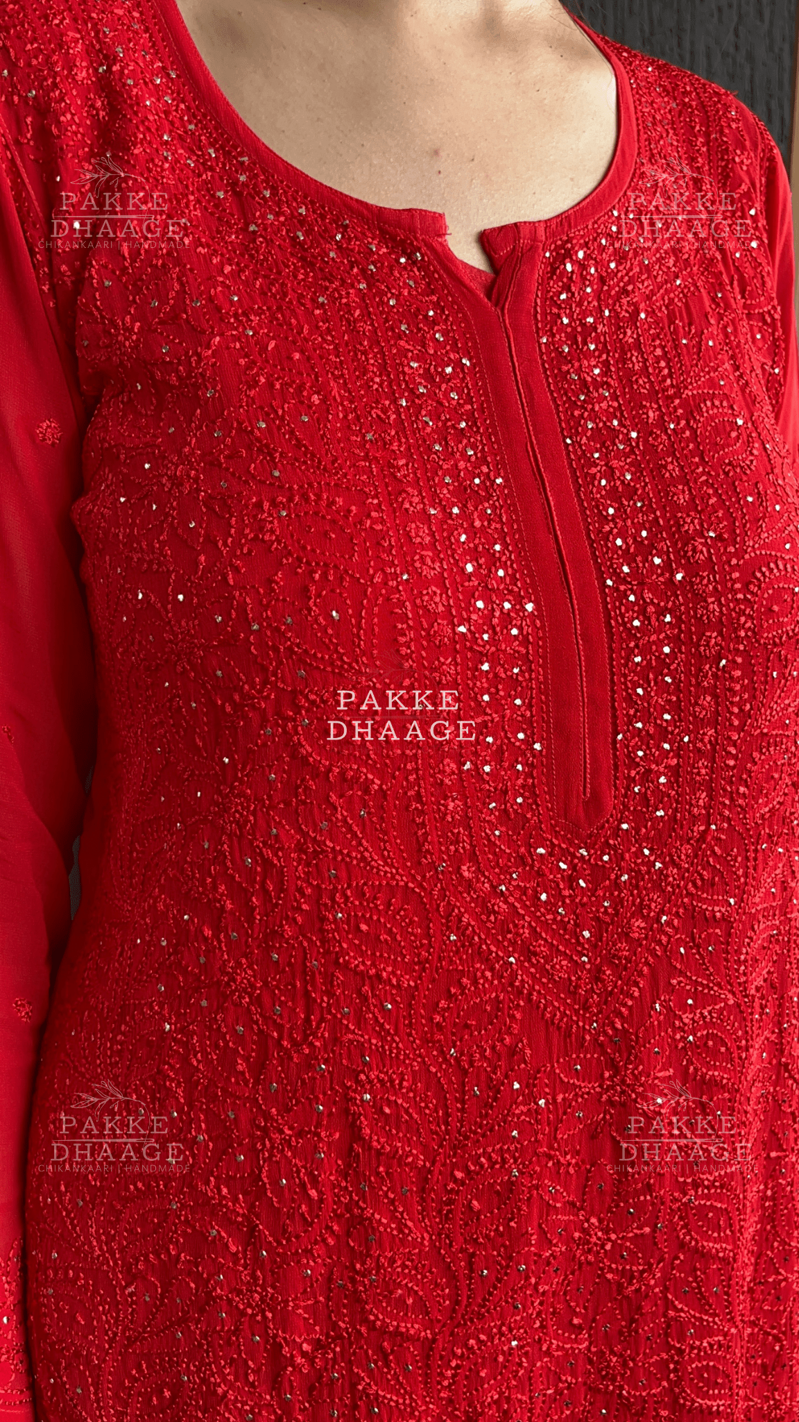 Red hand-embroidered chikankari kurta with intricate motifs and restrained mukaish work