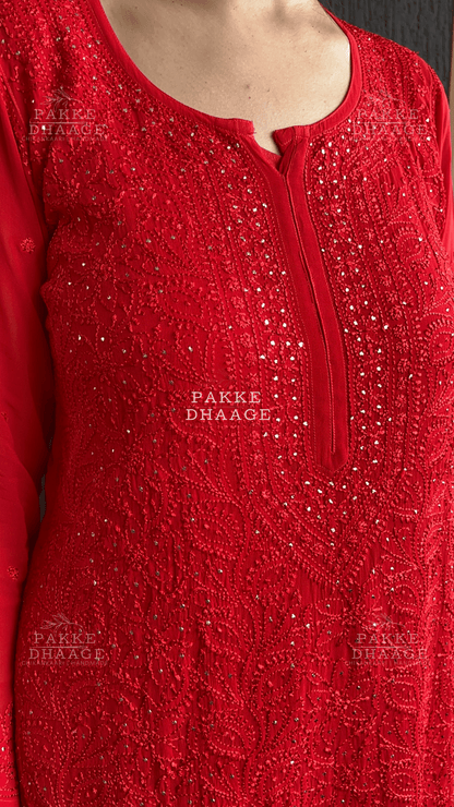 Red hand-embroidered chikankari kurta with intricate motifs and restrained mukaish work