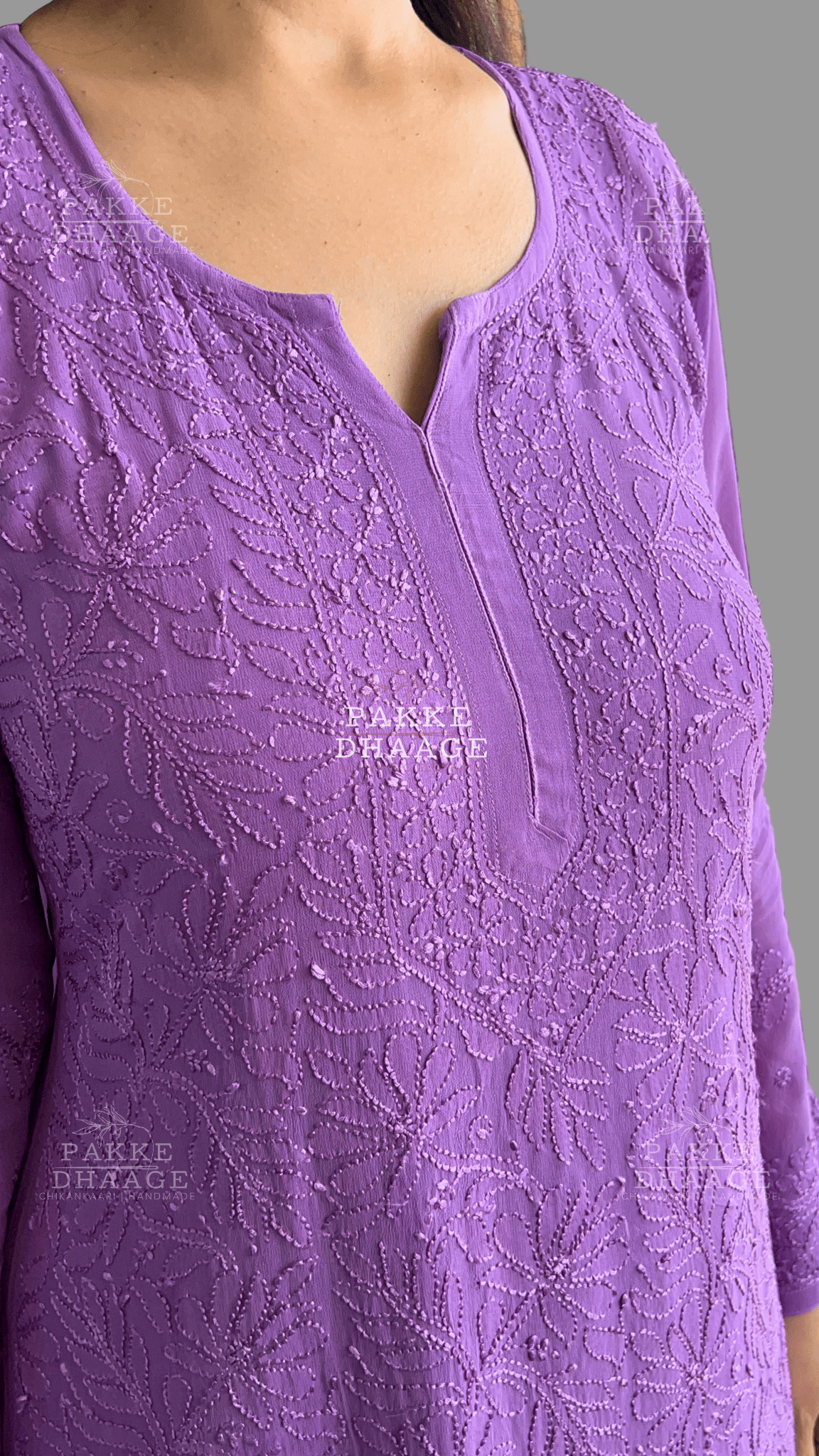 Close up shot of a purple chikankari kurta