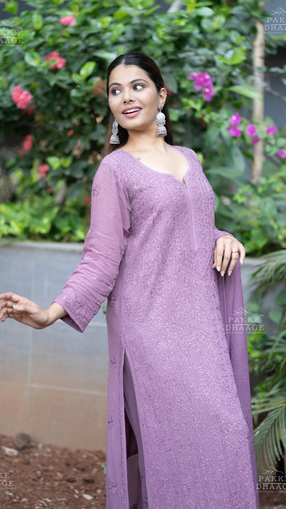 Woman wearing a plum traditional outfit with floral background